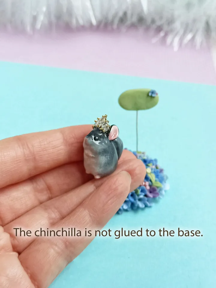 a tiny chinchilla figurine on the blue flower base with nameplate (US discount)