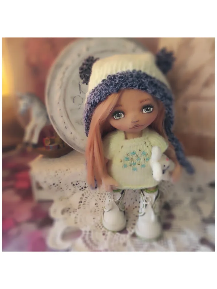 Cute little girl doll with a bunny