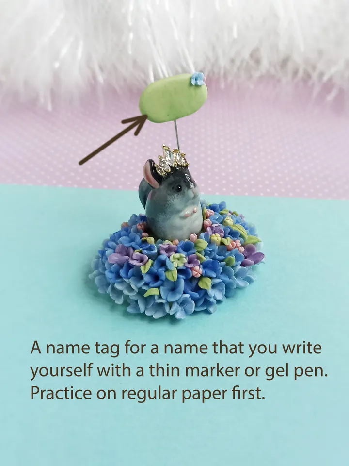 a tiny chinchilla figurine on the blue flower base with nameplate (US discount)