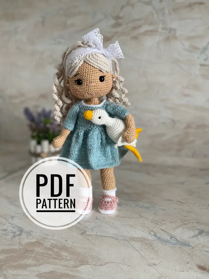 Doll with a goose crochet pattern