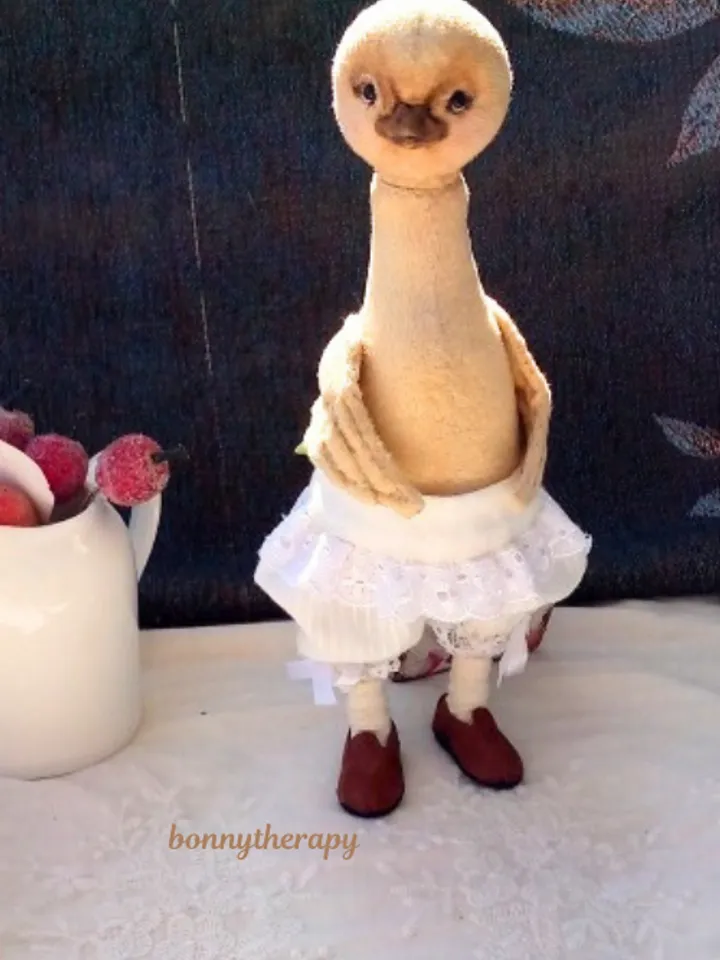 Cute duckling girl in clothes, artist doll duck