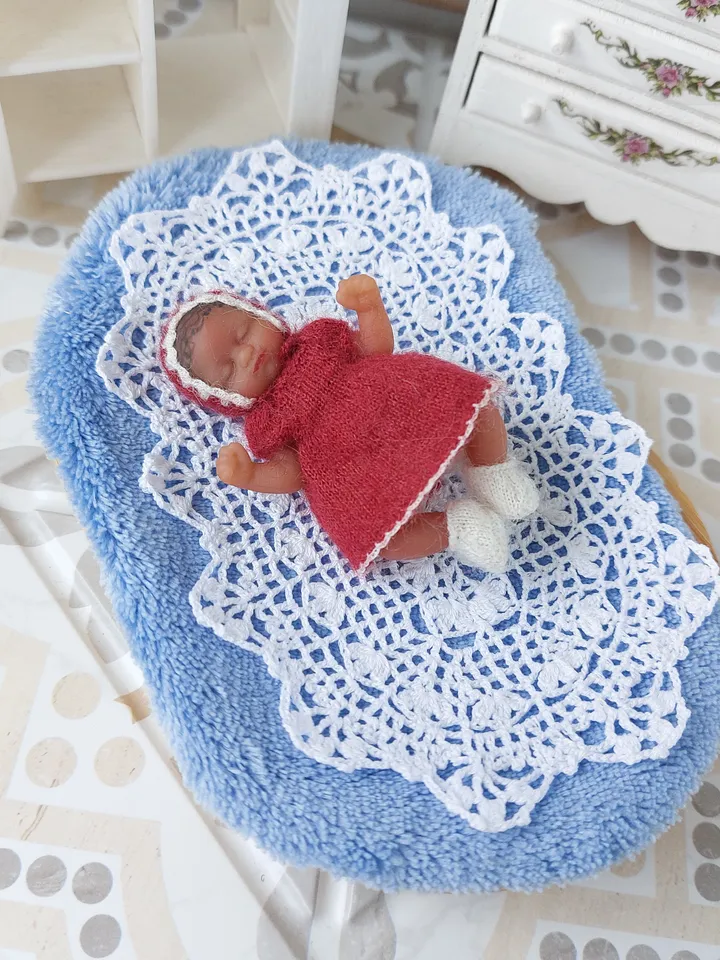 Miniature knitted red dress with white pants, socks and a hat for the silicone doll "My Mini Baby" by ZURU