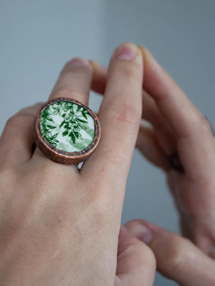 Unique handmade porcelain ring in a copper frame made using the electroforming process