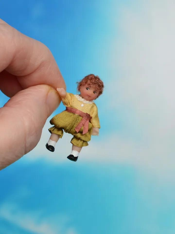 Miniature doll in 1/24 scale.  Doll toy to doll house.