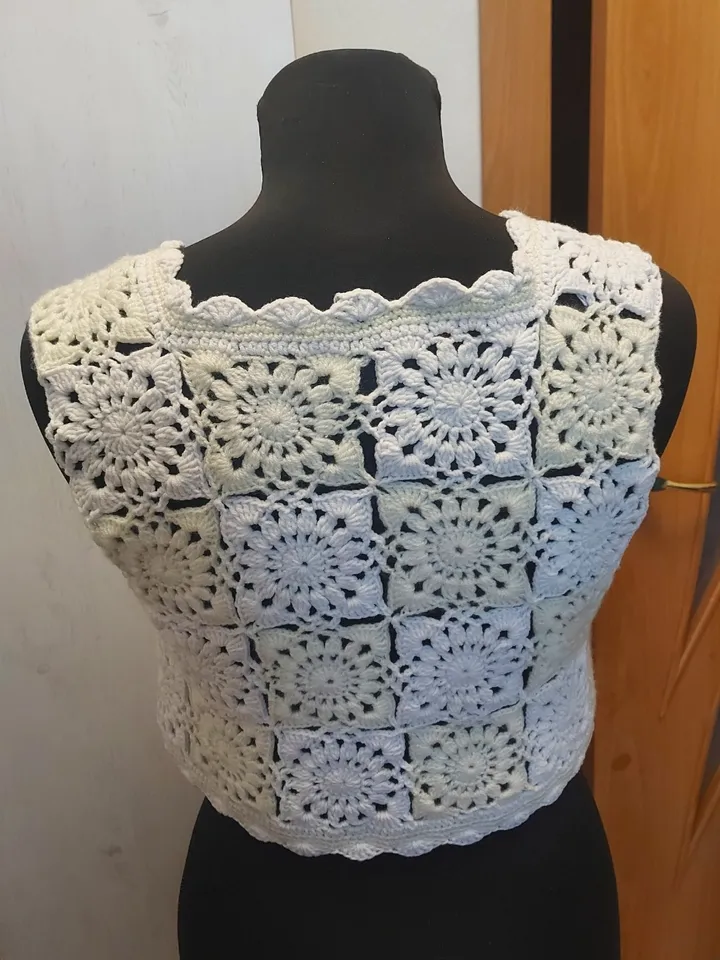Handmade vest from granny square in boho and retro style