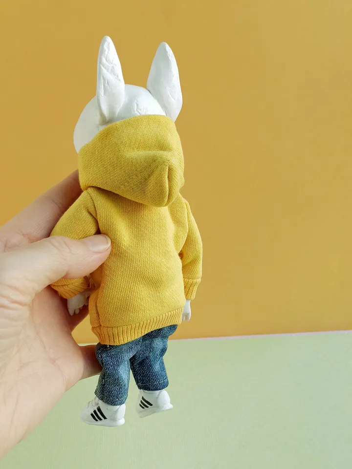 Bull Terrier doll in a yellow sweater