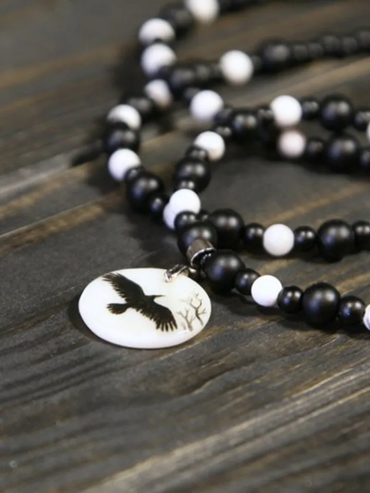 Raven or crow necklace with love rune on the other side. Nacre pearl pendant