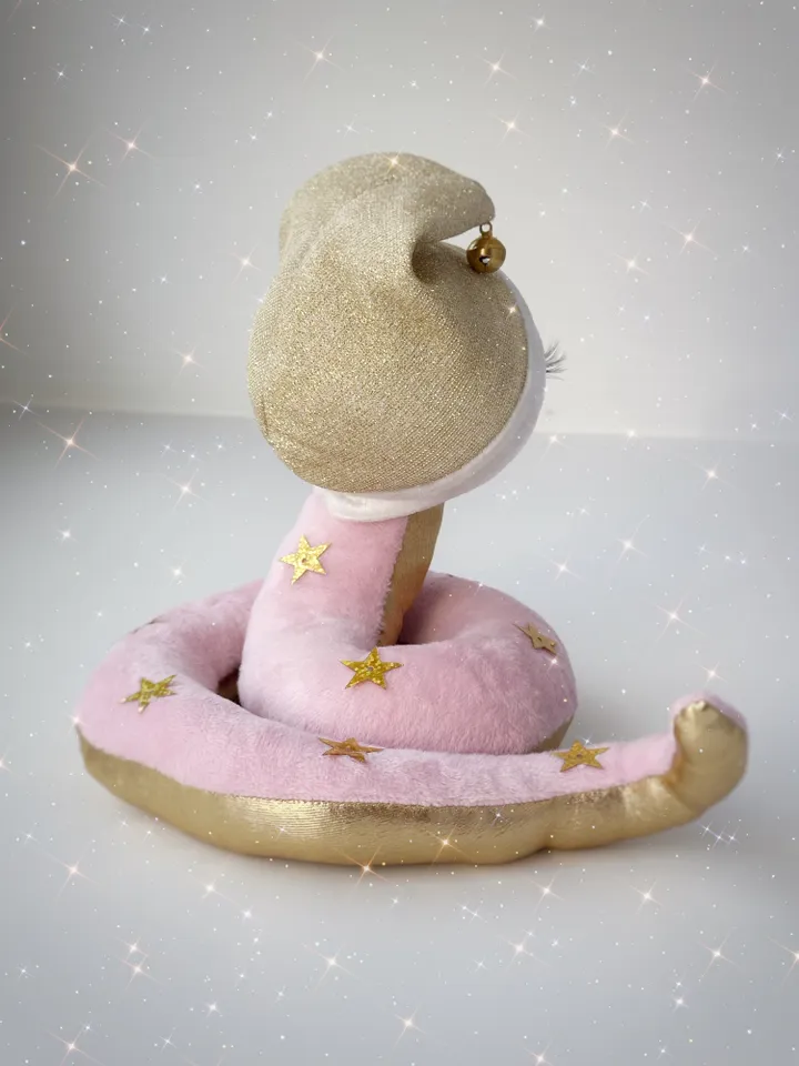Christmas plush soft snake. Handmade cute snake girl in holiday hat for home decor. Christmas snake for gift.