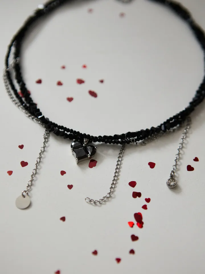 glass bead choker with black heart pendant