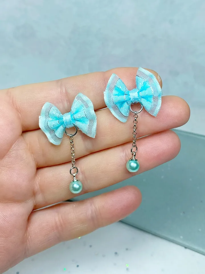 Handmade bow earrings. Author's work. Bright jewelry.