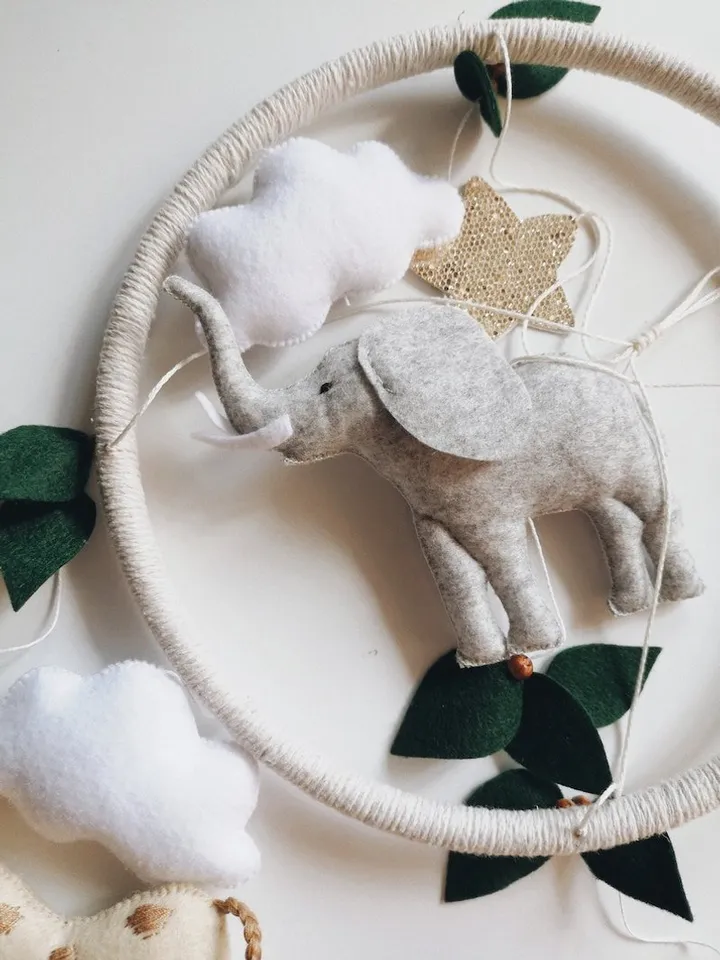 Safari mobile baby nursery decor crib