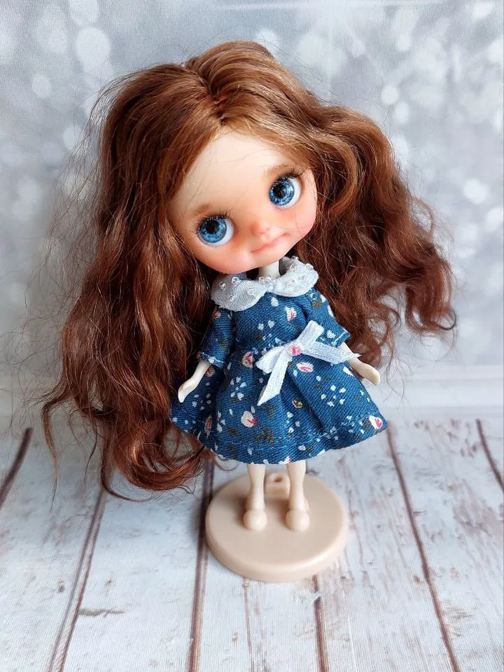 Charming little girl with brown hair and blue eyes. Author's miniature doll for your collection.