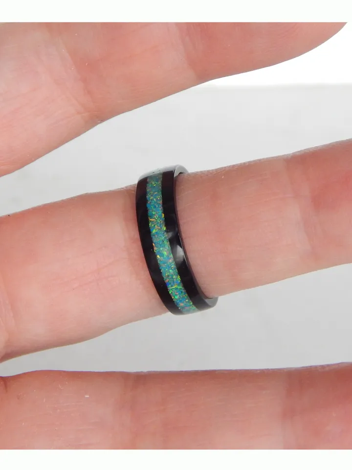 Stylish black ring. Carbon ring with synthetic opal. 9 1/4