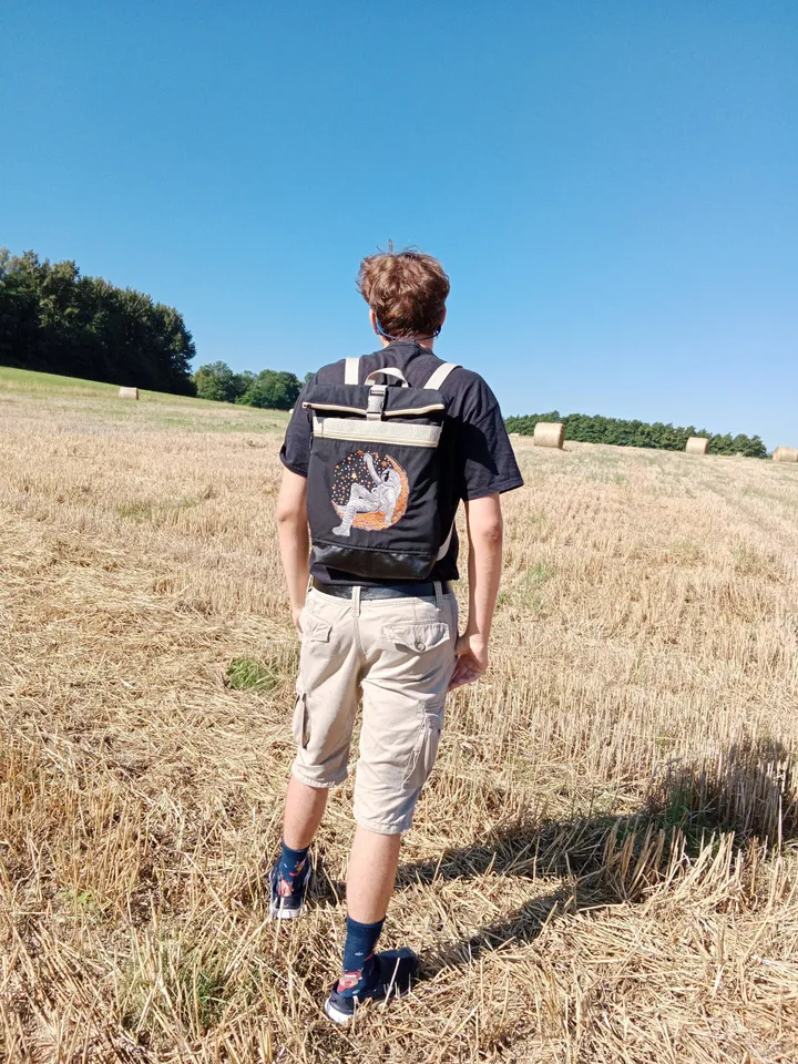 Roll top backpack with embroidery astronaut and stars