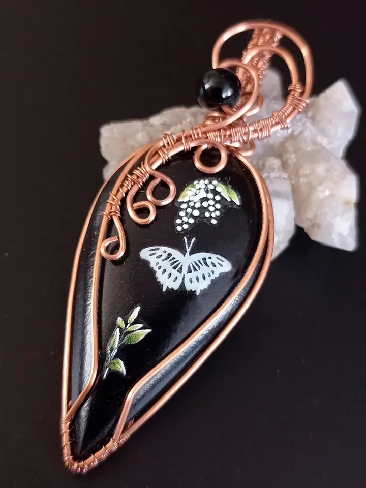 Black Necklace with a luminous butterfly. Luminous pendant as a gift. Jewelry of black stone on the neck