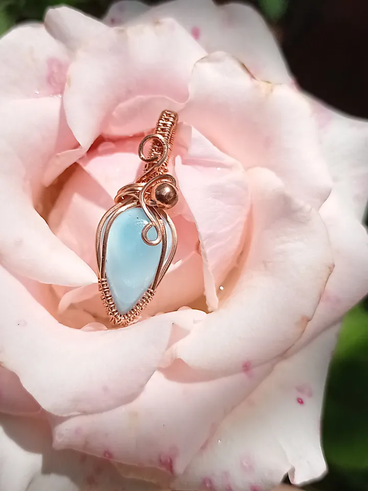 A tiny copper necklace with a rare precious larimar.