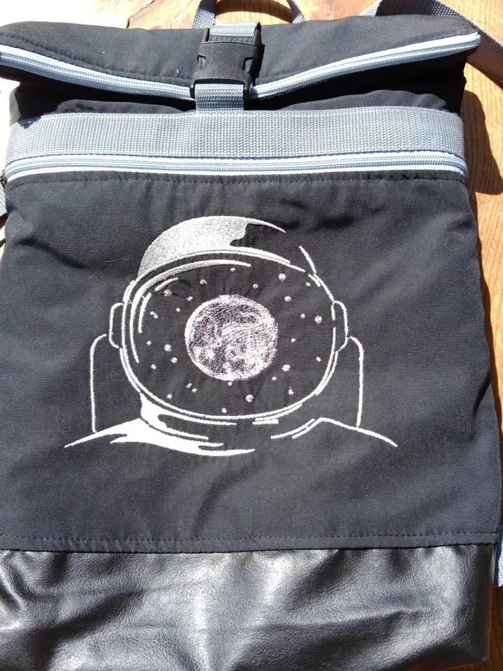 Roll top backpack with embroidery astronaut