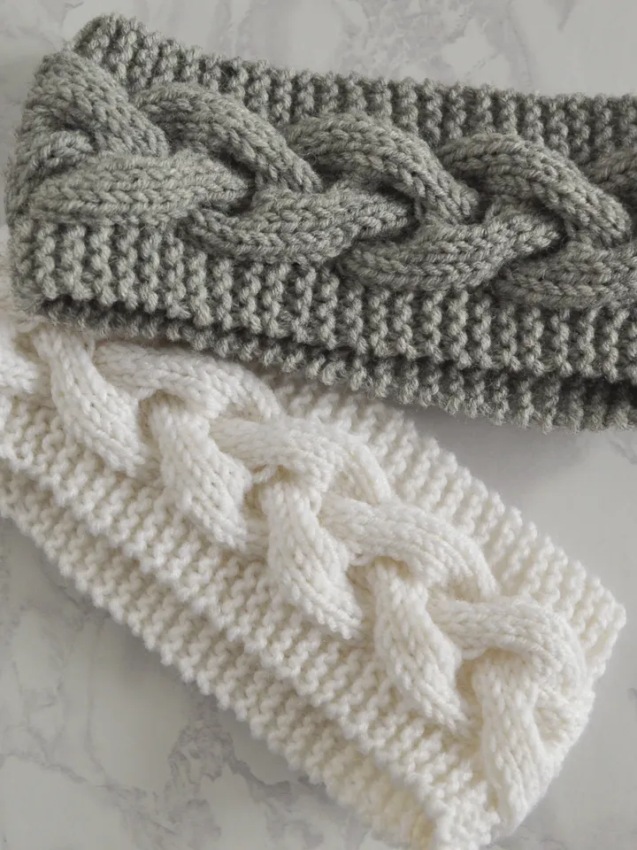 Knitted headband in gray with braid pattern