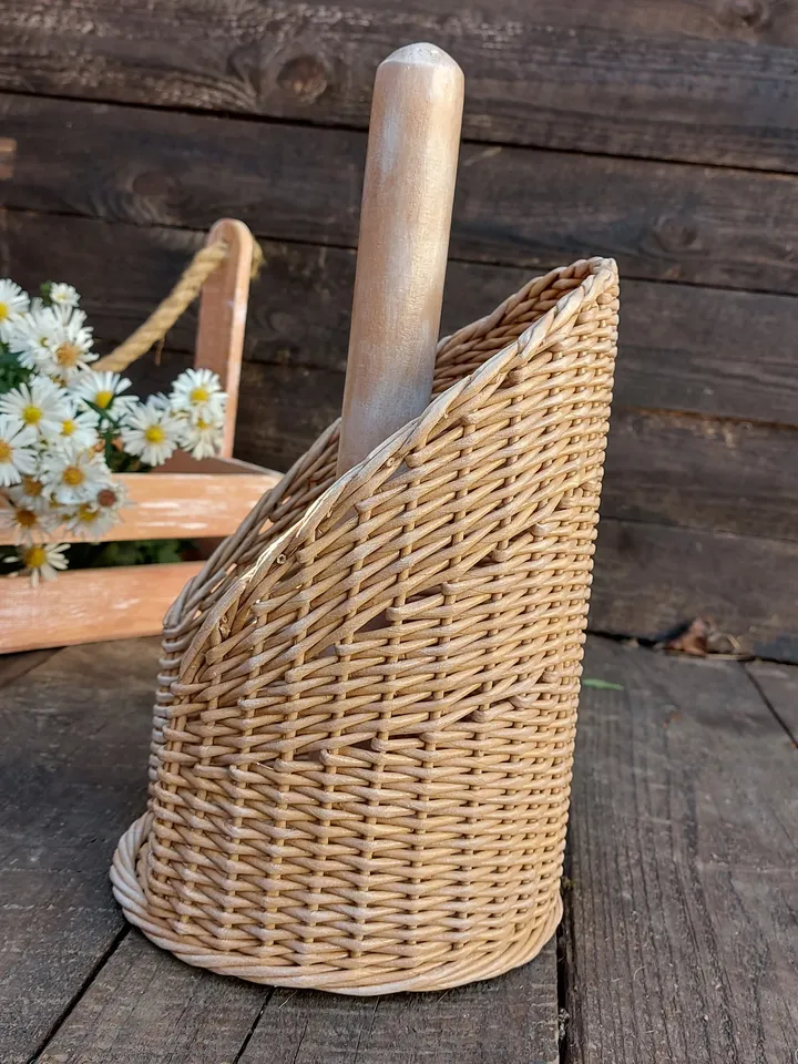 Standing towel holder. Rustic kitchen wicker roll holder. Beige towel rack on the countertop