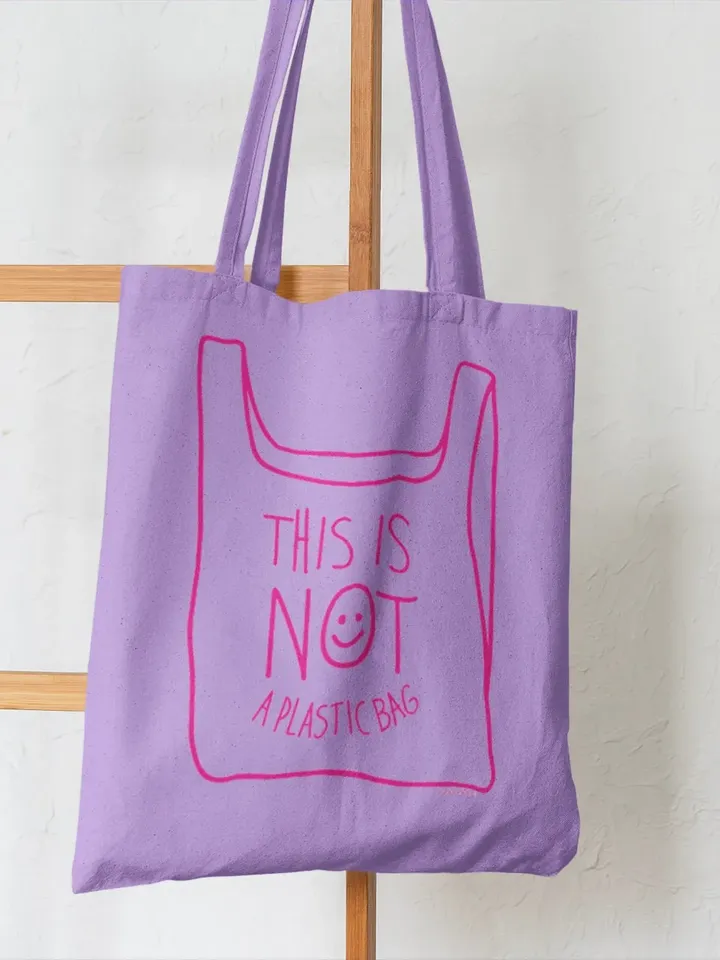 NOT A PLASTIC tote lila is a eco vegan friendly reusable grocery bag, market bag or gym bag. Say No to Plastic with this anti plastic tote.