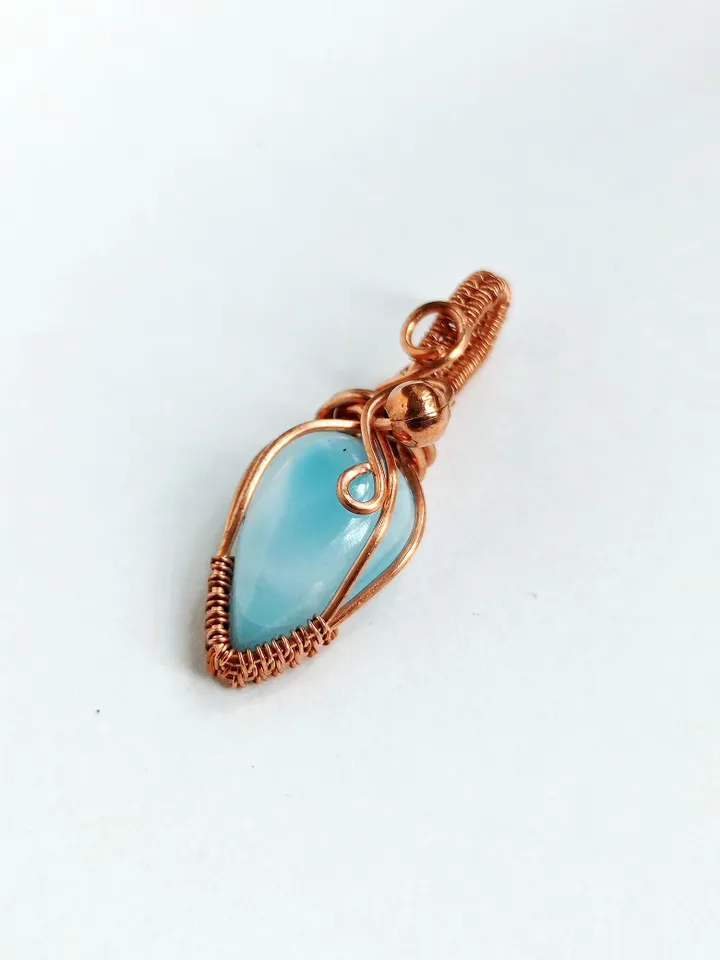 A tiny copper necklace with a rare precious larimar.