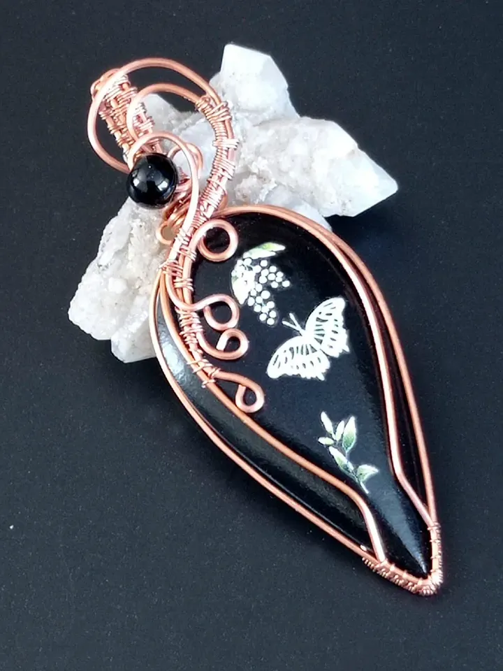 Black Necklace with a luminous butterfly. Luminous pendant as a gift. Jewelry of black stone on the neck