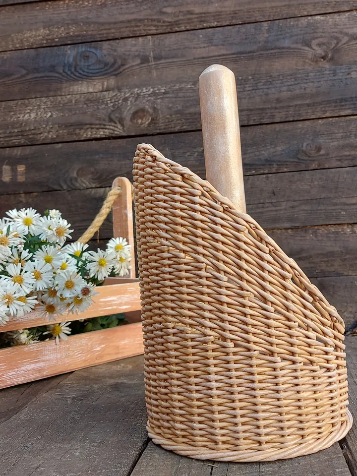 Standing towel holder. Rustic kitchen wicker roll holder. Beige towel rack on the countertop