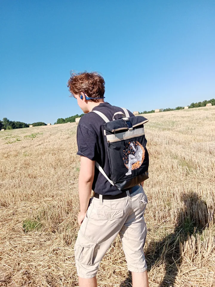 Roll top backpack with embroidery astronaut and stars