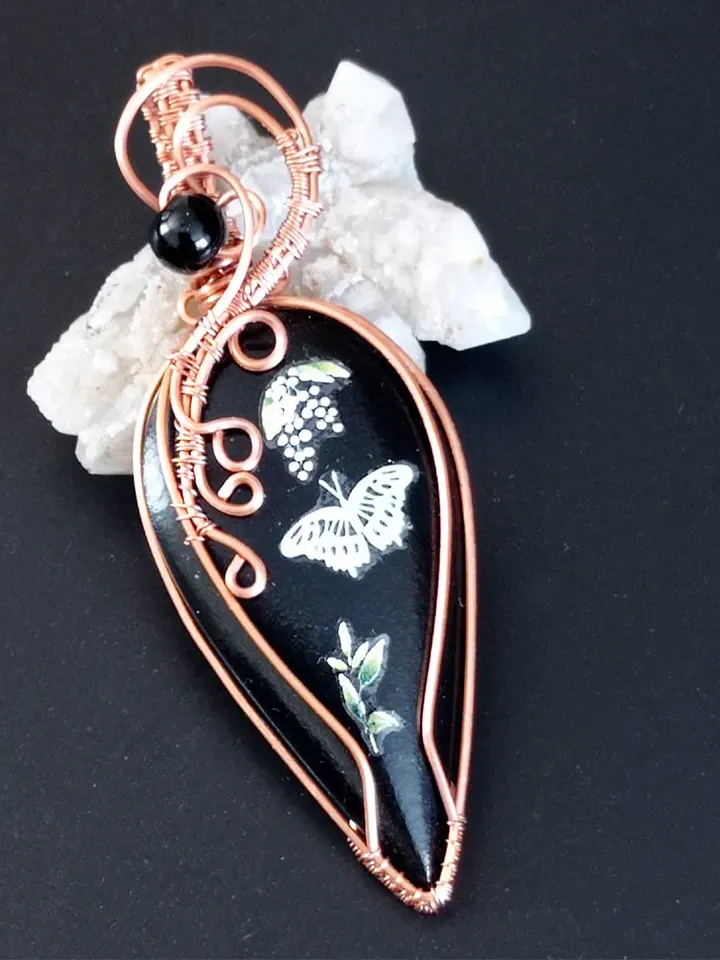 Black Necklace with a luminous butterfly. Luminous pendant as a gift. Jewelry of black stone on the neck
