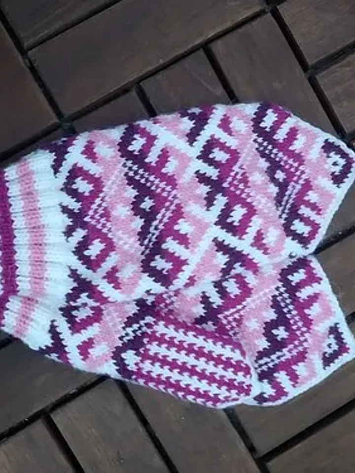 Women's hand-knitted wool mittens are very warm with a pattern