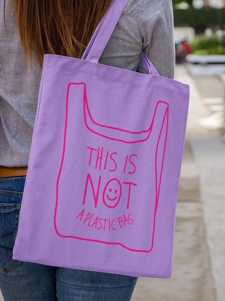 NOT A PLASTIC tote lila is a eco vegan friendly reusable grocery bag, market bag or gym bag. Say No to Plastic with this anti plastic tote.