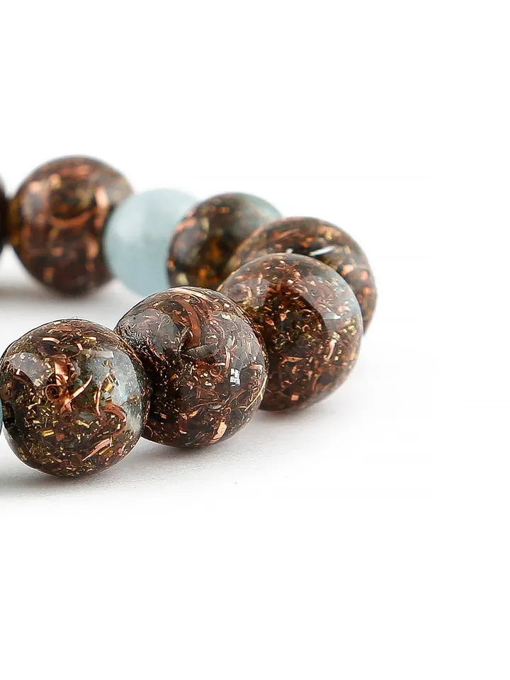 Orgonite aquamarine, serenity, throat chakra bracelet. The power of aquamarine is increased with incense and Tibetan bowls.