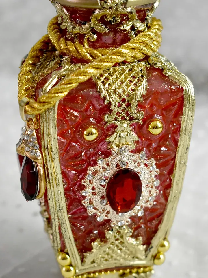 Red glass bottle for perfumes or aromatic oils dressing table decoration