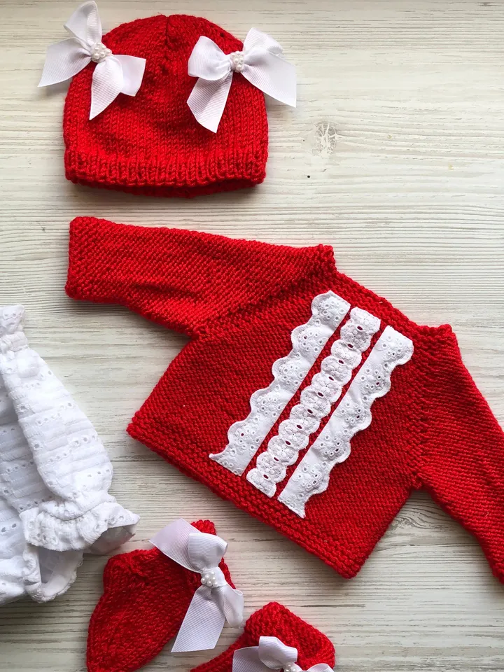 Knit red sweater with white lace, white lace panties, hat with bows and pearls, socks. Take home outfit for baby. Baby shower gift for girl