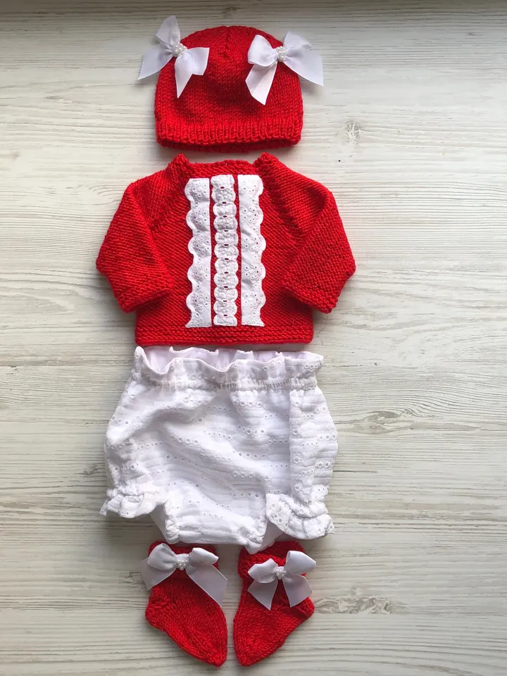 Knit red sweater with white lace, white lace panties, hat with bows and pearls, socks. Take home outfit for baby. Baby shower gift for girl