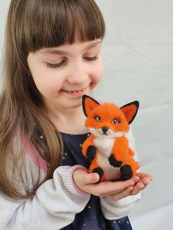 A small fox-boyfriend of dry felting. Fox for decorating a room. A toy made of natural wool.
