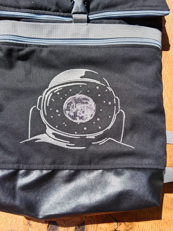 Roll top backpack with embroidery astronaut