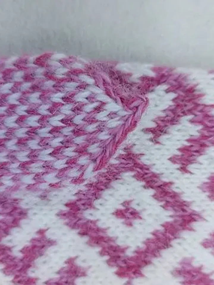Women's hand-knitted wool mittens are very warm with a pattern