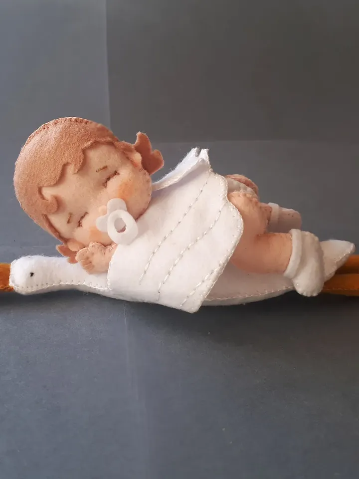 Baby doll and goose hugging sleep pillow for a fairytale nursery sewing pattern out of felt