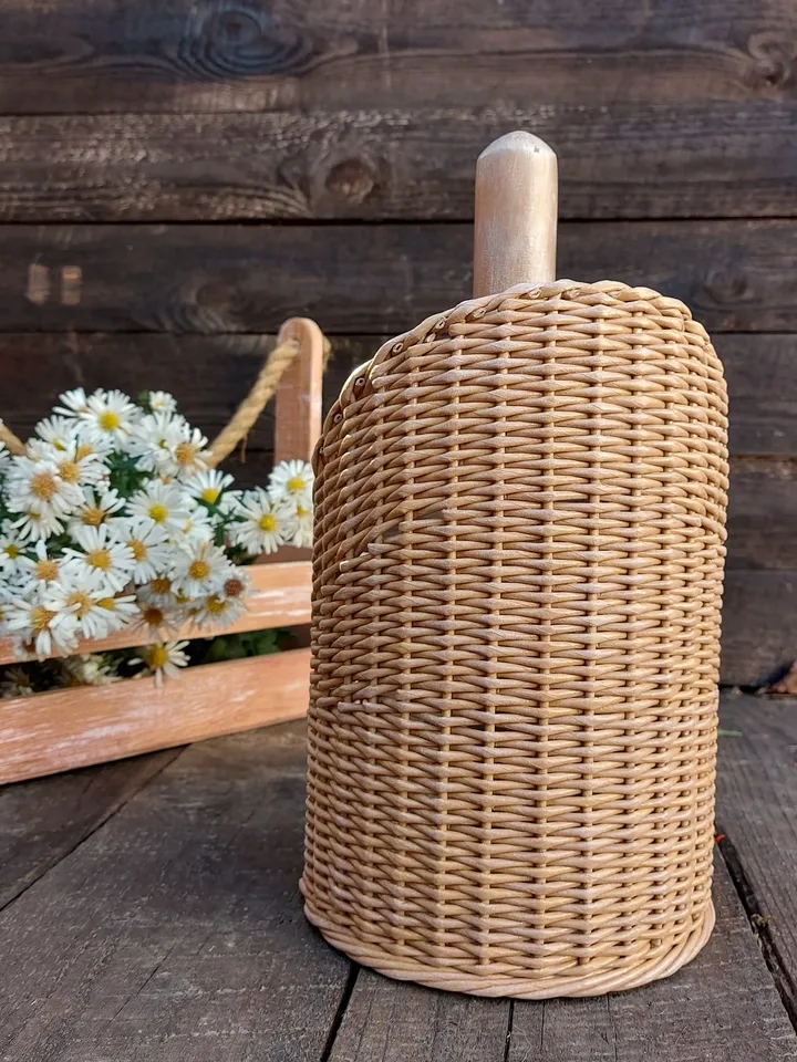 Standing towel holder. Rustic kitchen wicker roll holder. Beige towel rack on the countertop