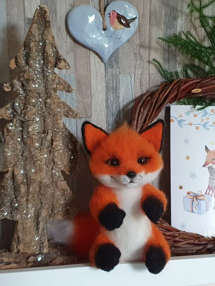 Small fox-girl of dry felting. Fox for decorating a room. A toy made of natural wool.