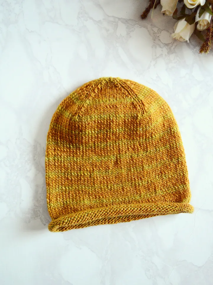 Knitted mustard colored beanie hat for women