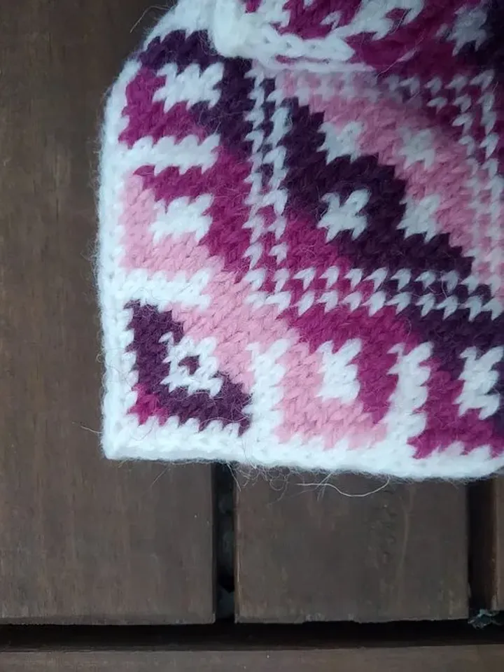 Women's hand-knitted wool mittens are very warm with a pattern
