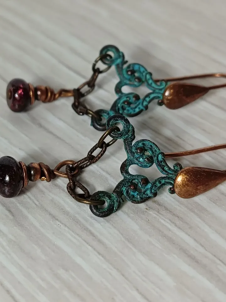 Boho Shabby chic Vintage style solid and natural copper earrings Textured patinated with a garnet bead and chain