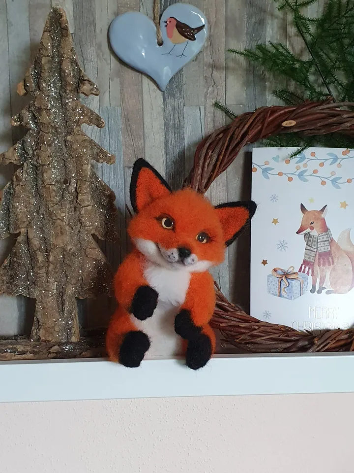 A small fox-boyfriend of dry felting. Fox for decorating a room. A toy made of natural wool.