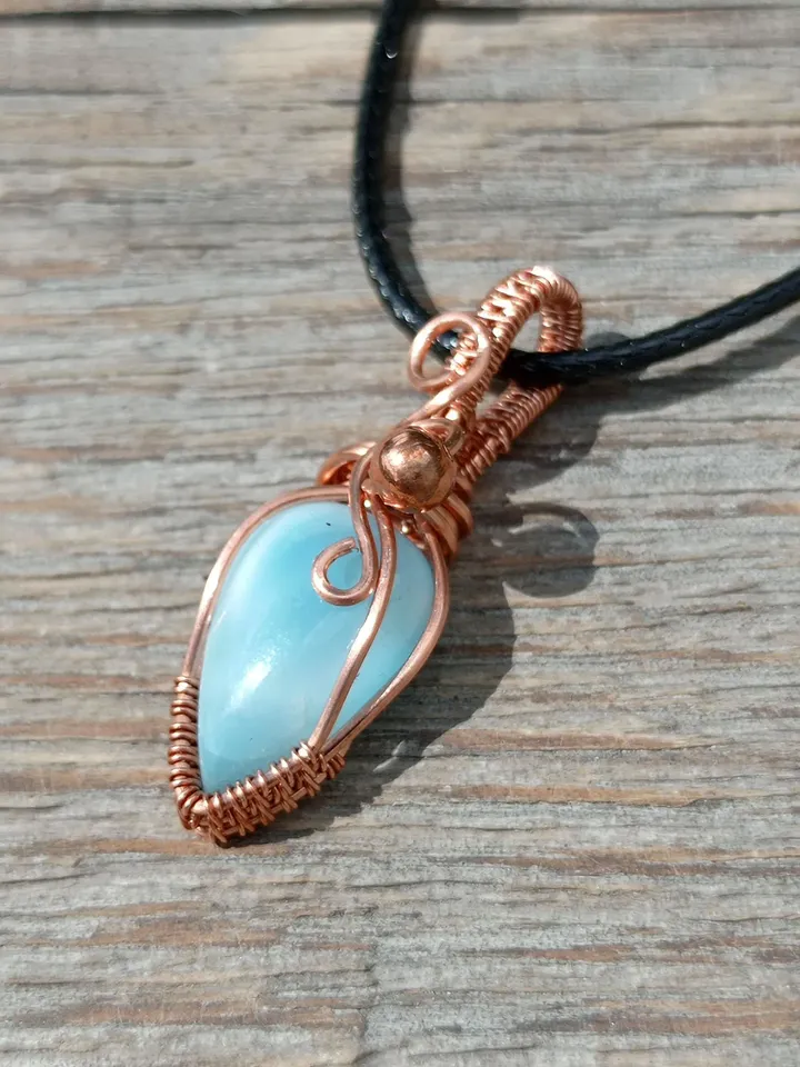 A tiny copper necklace with a rare precious larimar.