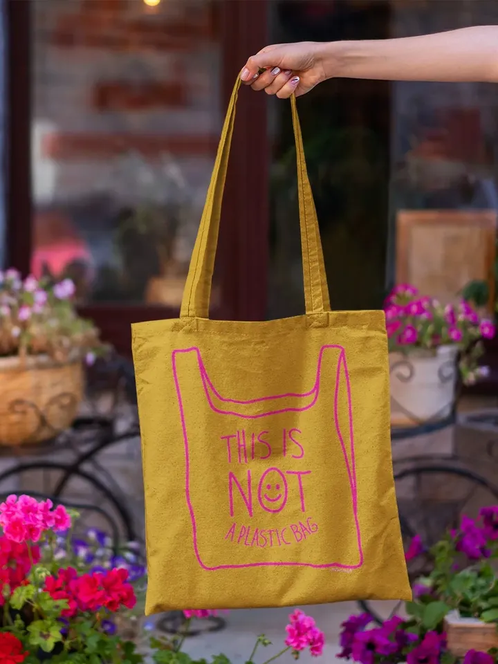 NOT A PLASTIC tote Mustard is a eco vegan friendly reusable grocery bag, market bag, gym bag. Say No to Plastic with this anti plastic tote.
