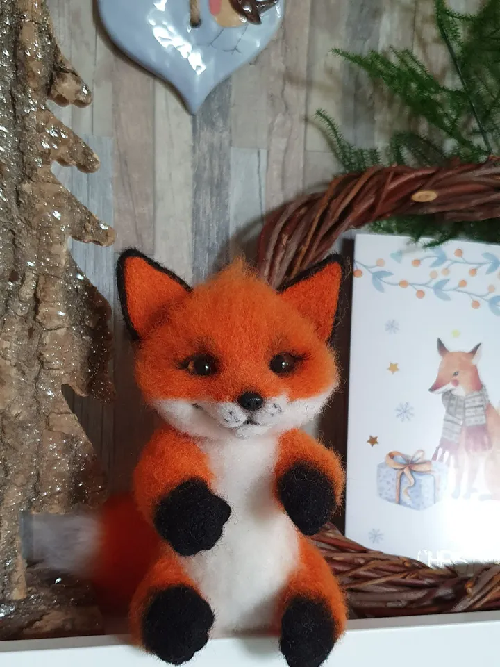 Small fox-girl of dry felting. Fox for decorating a room. A toy made of natural wool.