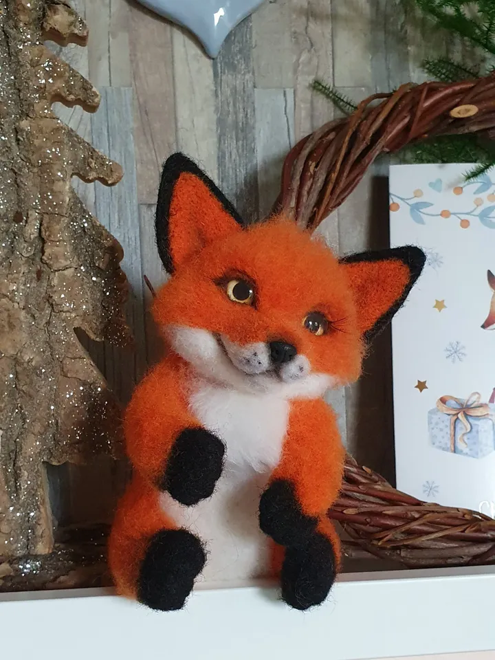 A small fox-boyfriend of dry felting. Fox for decorating a room. A toy made of natural wool.