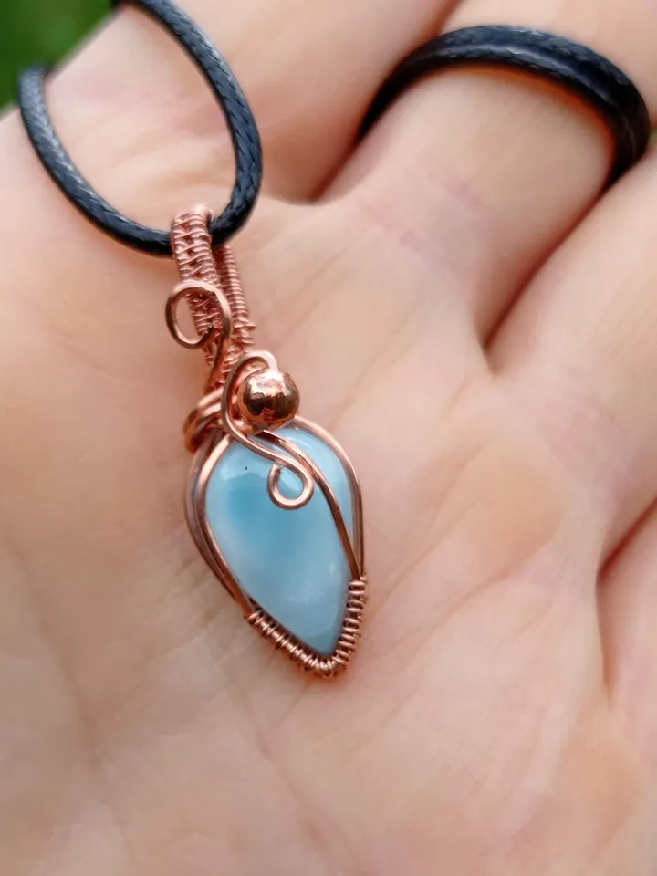 A tiny copper necklace with a rare precious larimar.
